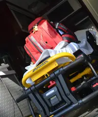 Stretcher and emergency medical kit loaded in a Surokkha ambulance